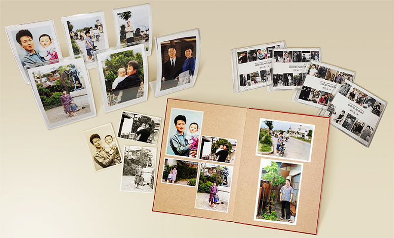 完成したフォトブックとスタンド、CDの写真